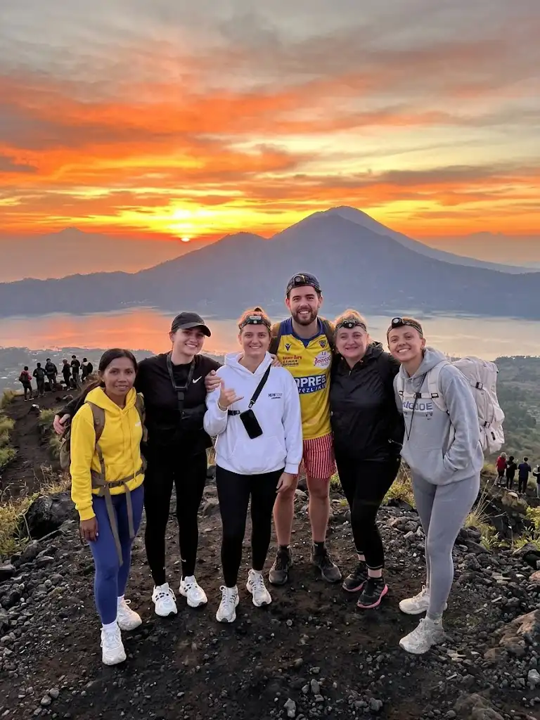 Mount Batur Sunrise Trekking with Local Guide, experienced trekking guide leading hikers to the summit of Mount Batur in Bali